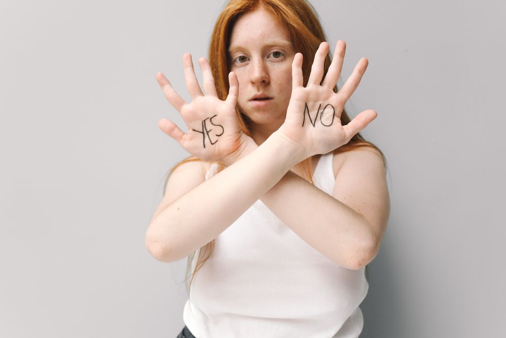 a woman hands with yes or no